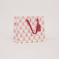 Block printed gift bag in Bows Christmas Pudding pattern, Medium size